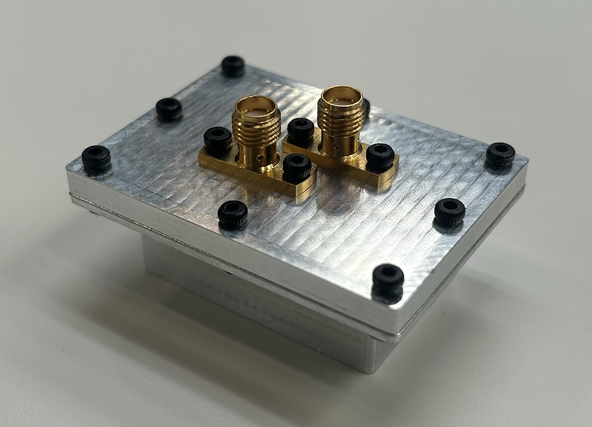 Machined aluminum microwave cavity resonator with two SMA coupling ports